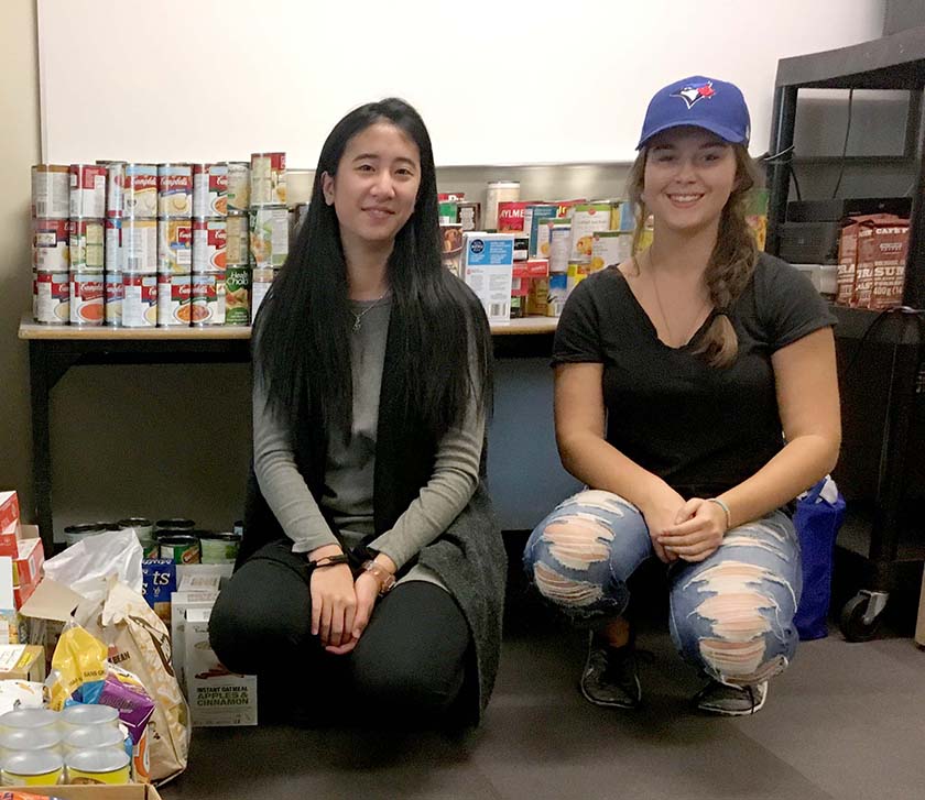 Taylor Ko and Alyssa Cable helped collect and sort the food for Rebels for a Cause.