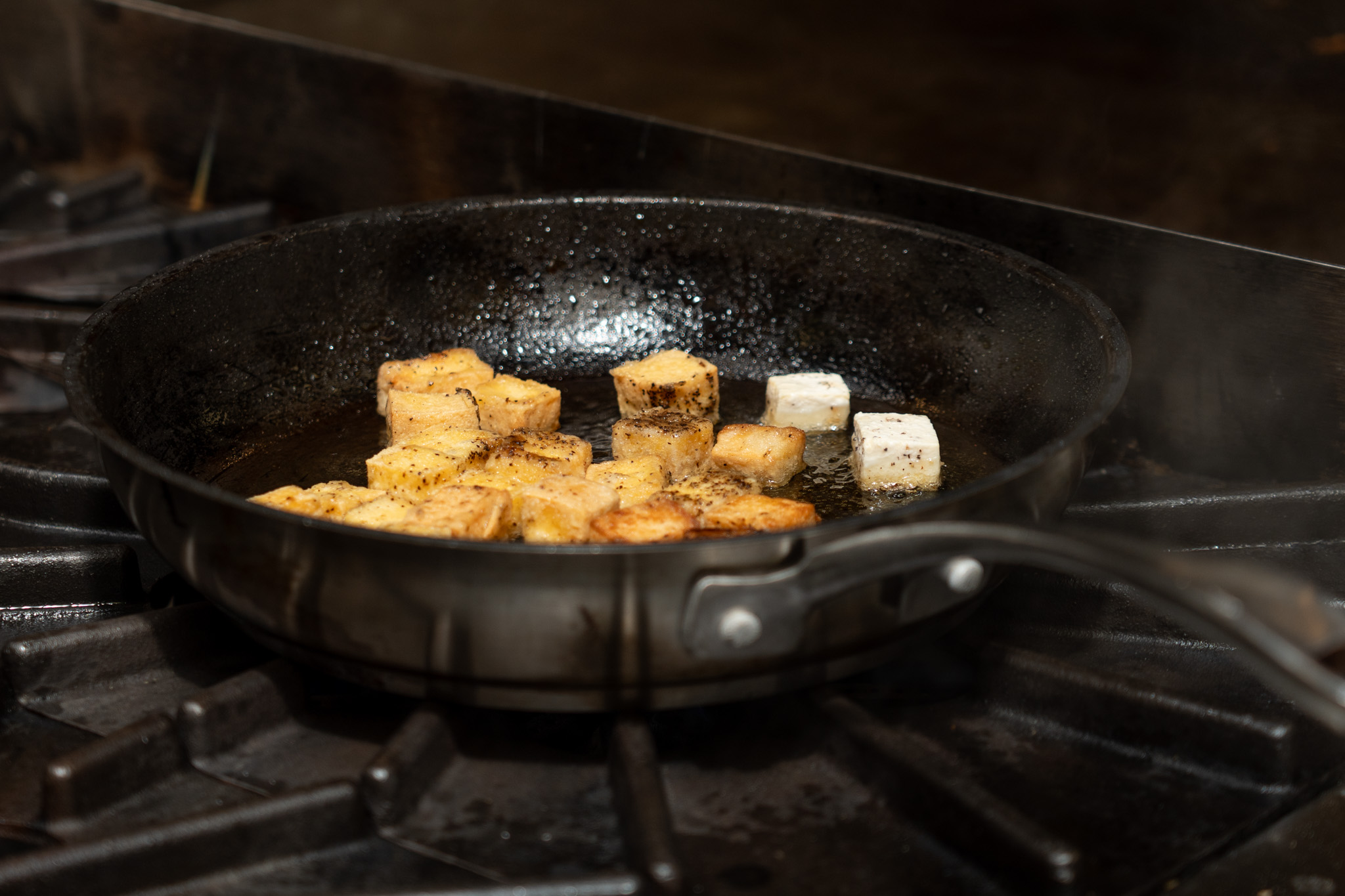 2026-10 CHEF RANDLE AWARD-14 Tofu cooking in a pan.