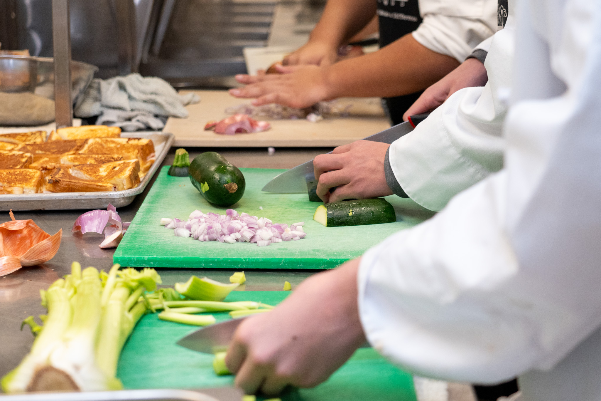 2026-10 CHEF RANDLE AWARD-17 Students cut vegetables in the Maple Ridge Secondary teaching kitchen.