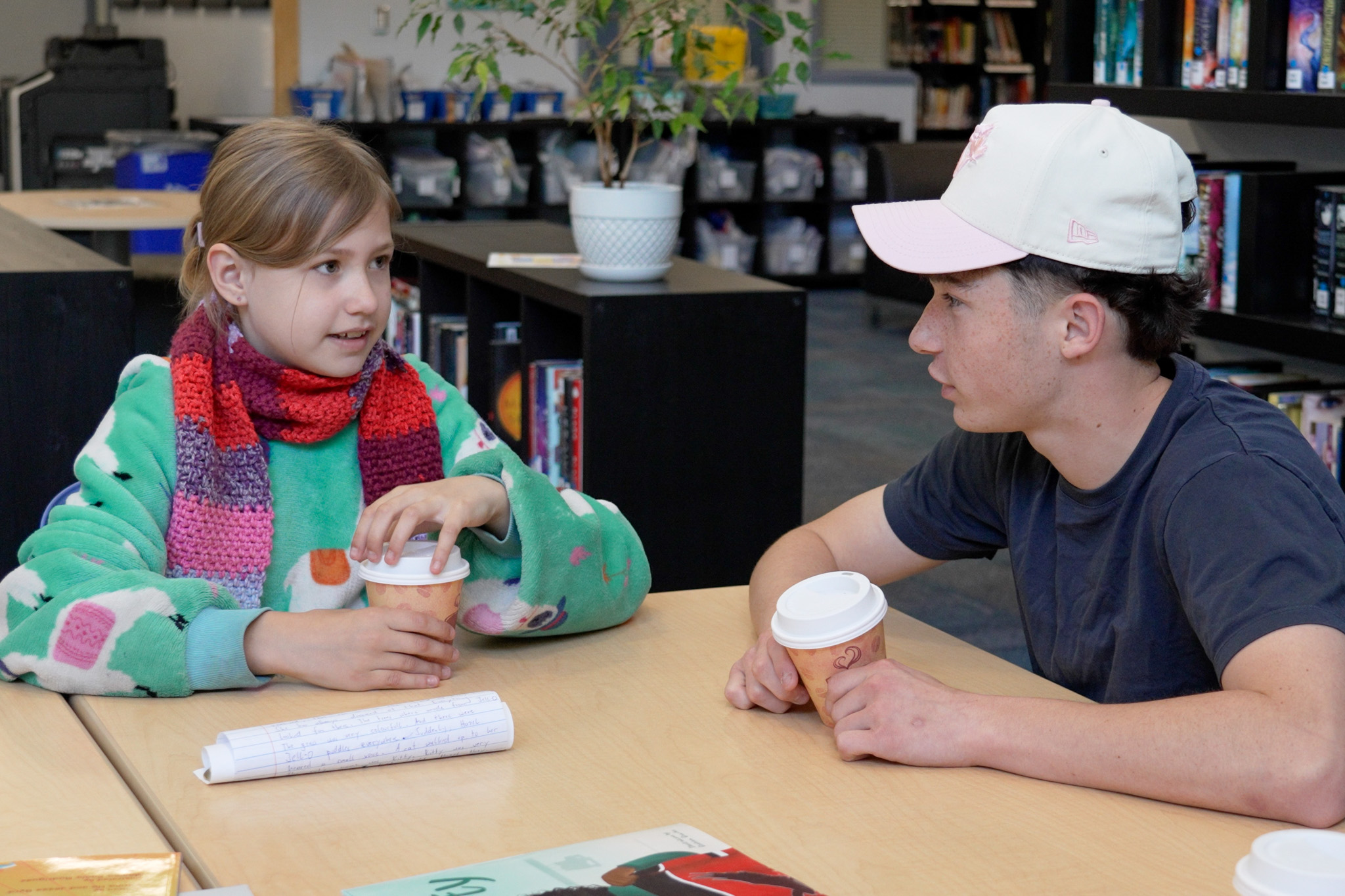 BOOK BUDDIES WSS HAM-2 A Westview Secondary student presents the story they wrote to their Hammond Elementary book buddy.