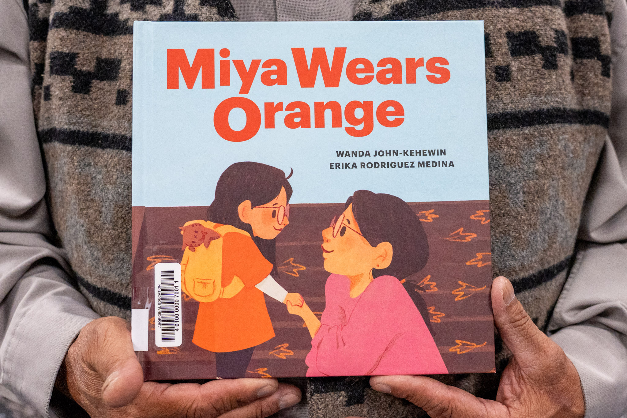 “Miya Wears Orange” by Wanda John-Kehewin.