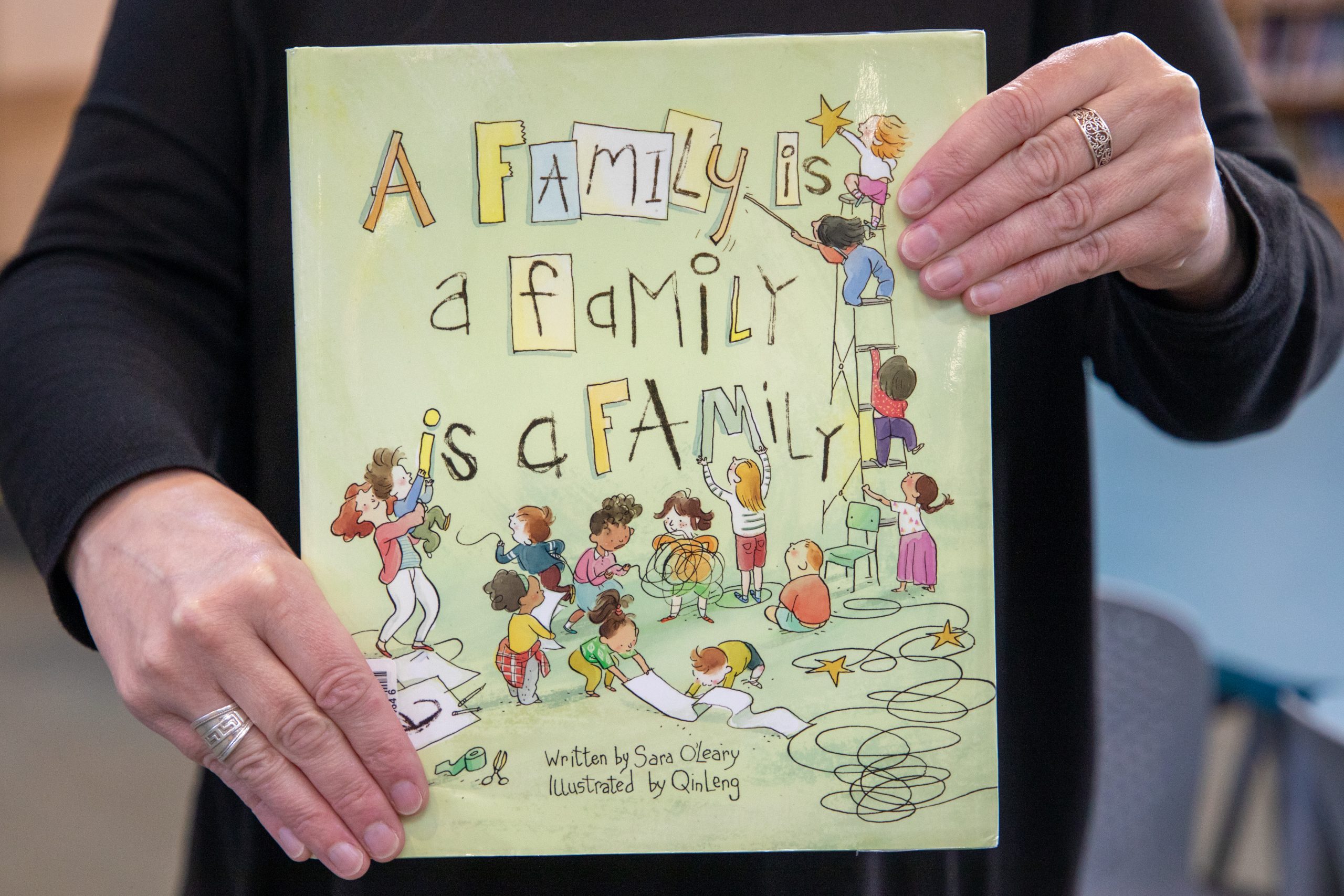 The cover of the book "A Family Is a Family Is a Family" by Sara O'Leary.