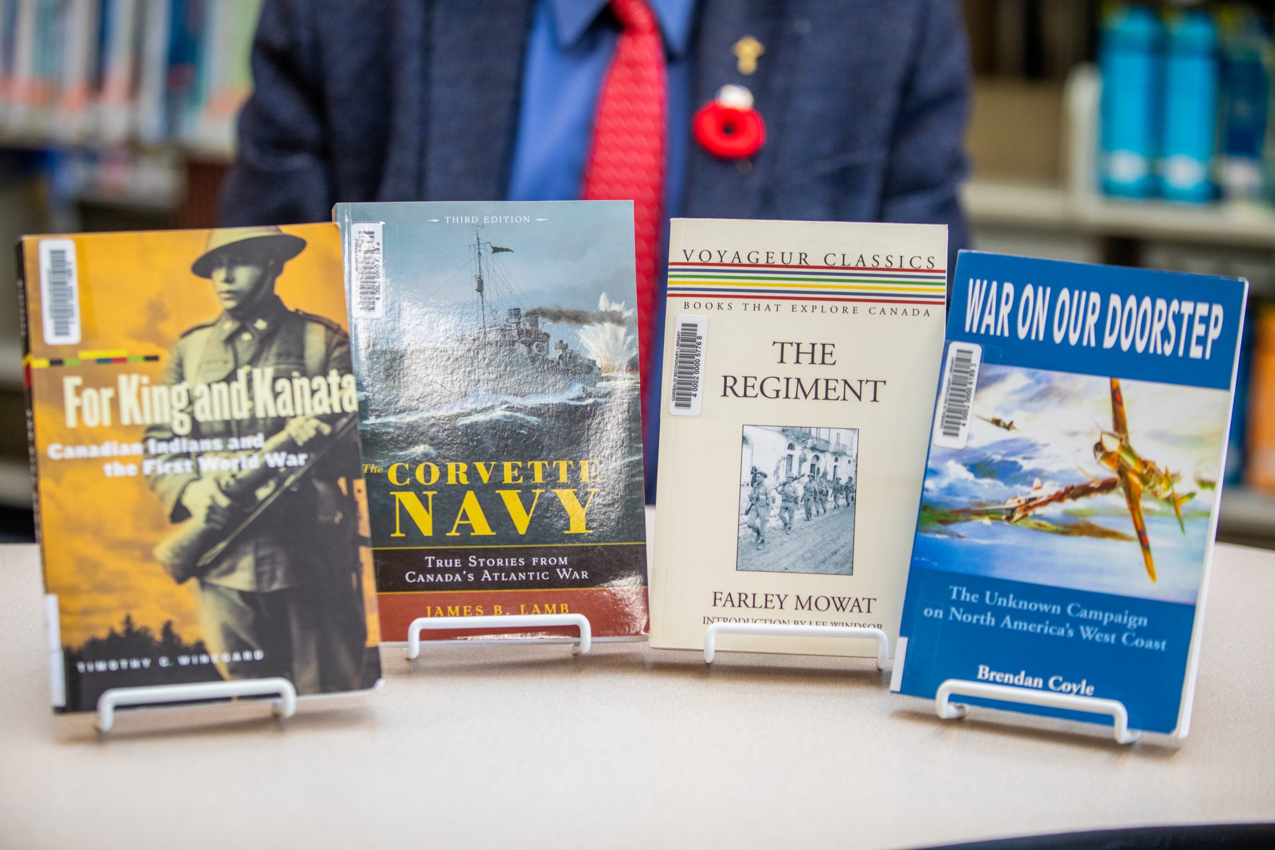 The book covers of "For King and Kanata," "The Corvette Navy," "War on Our Doorstep," and "The Regiment."
