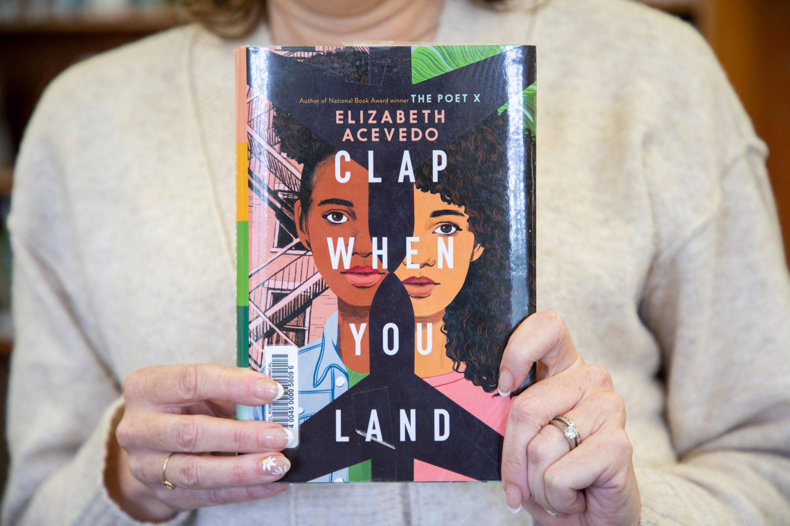 "Clap When You Land" by Elizabeth Acevedo.