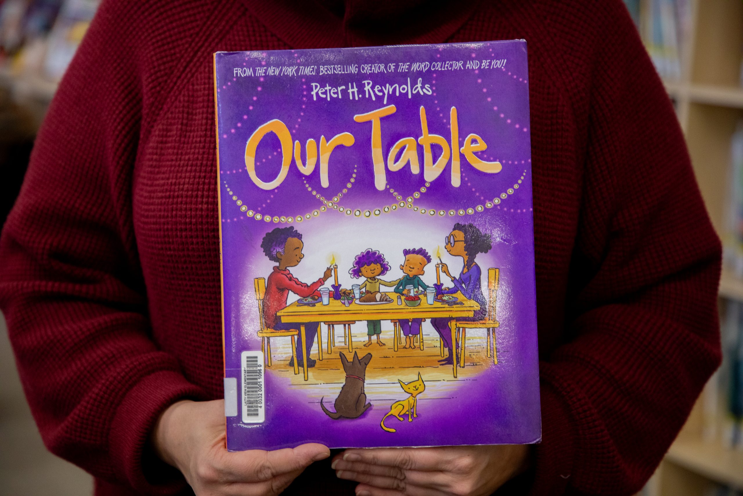 The cover of the book, "Our Table," by Peter H. Reynolds.